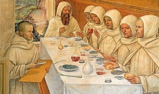 Fresko eines langen, gedeckten Tischs. Am Ende des Tischs sitzt der heilige Benedikt und speist mit seinen Mönchen.