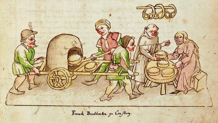 Ein Bild aus der Richental-Chronik ist zu sehen. 5 Personen bereiten Brot zu mit einem historischen, mobilen Backofen.